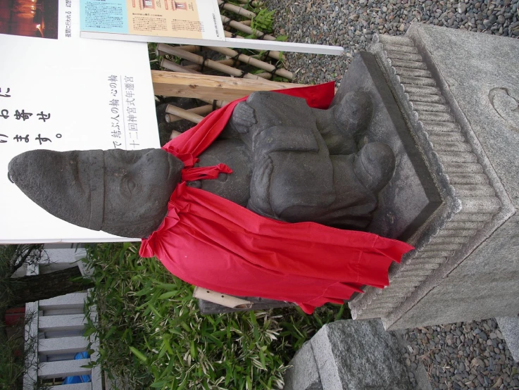 a statue of a sphinx wearing a cape