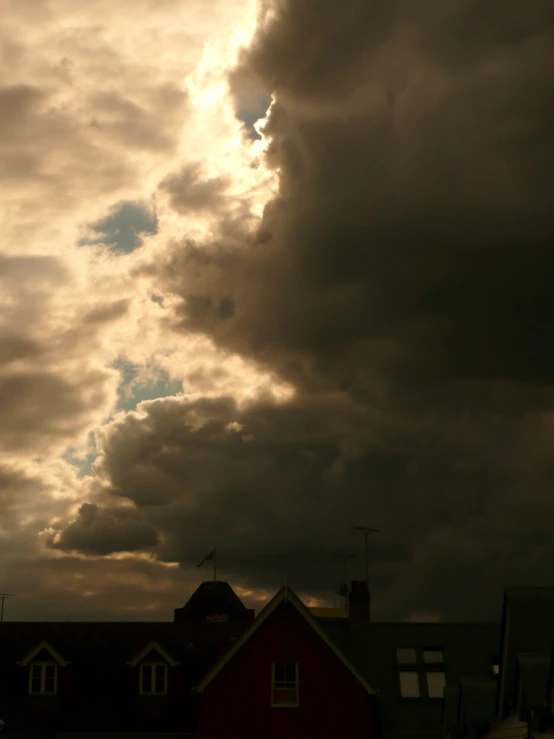 there is a building and the clouds in the sky