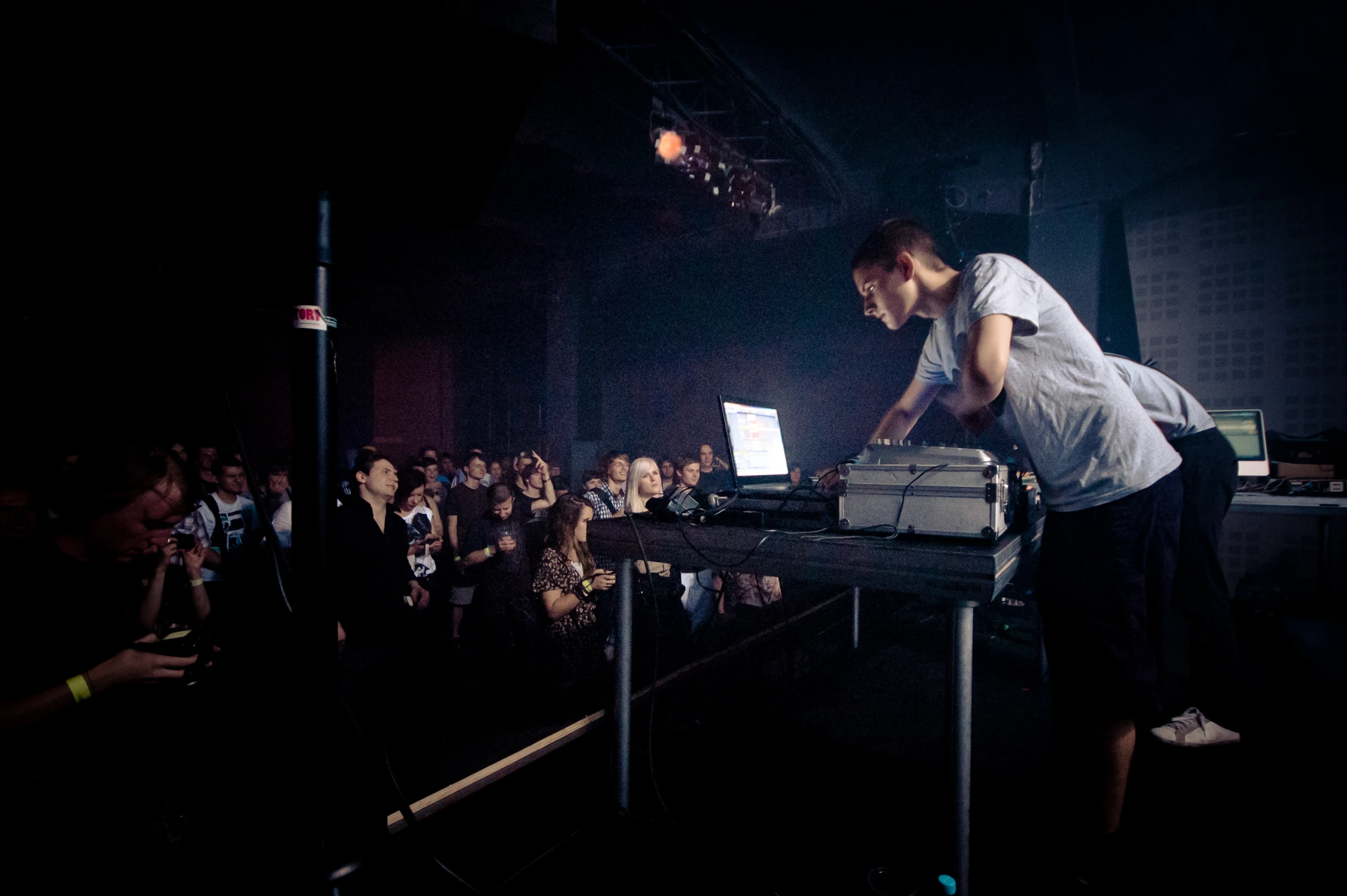 a man is playing a set of turntables on a black table