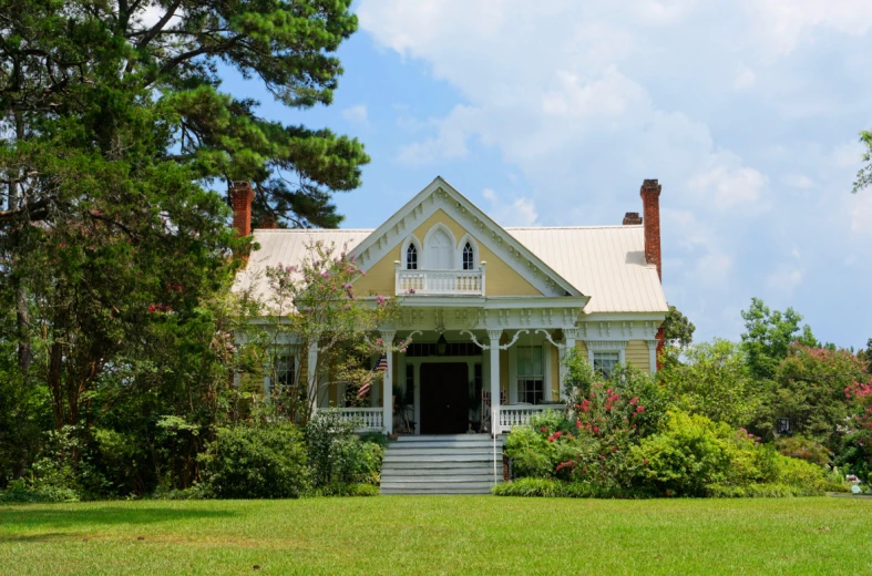 a home sits in the grass on a sunny day