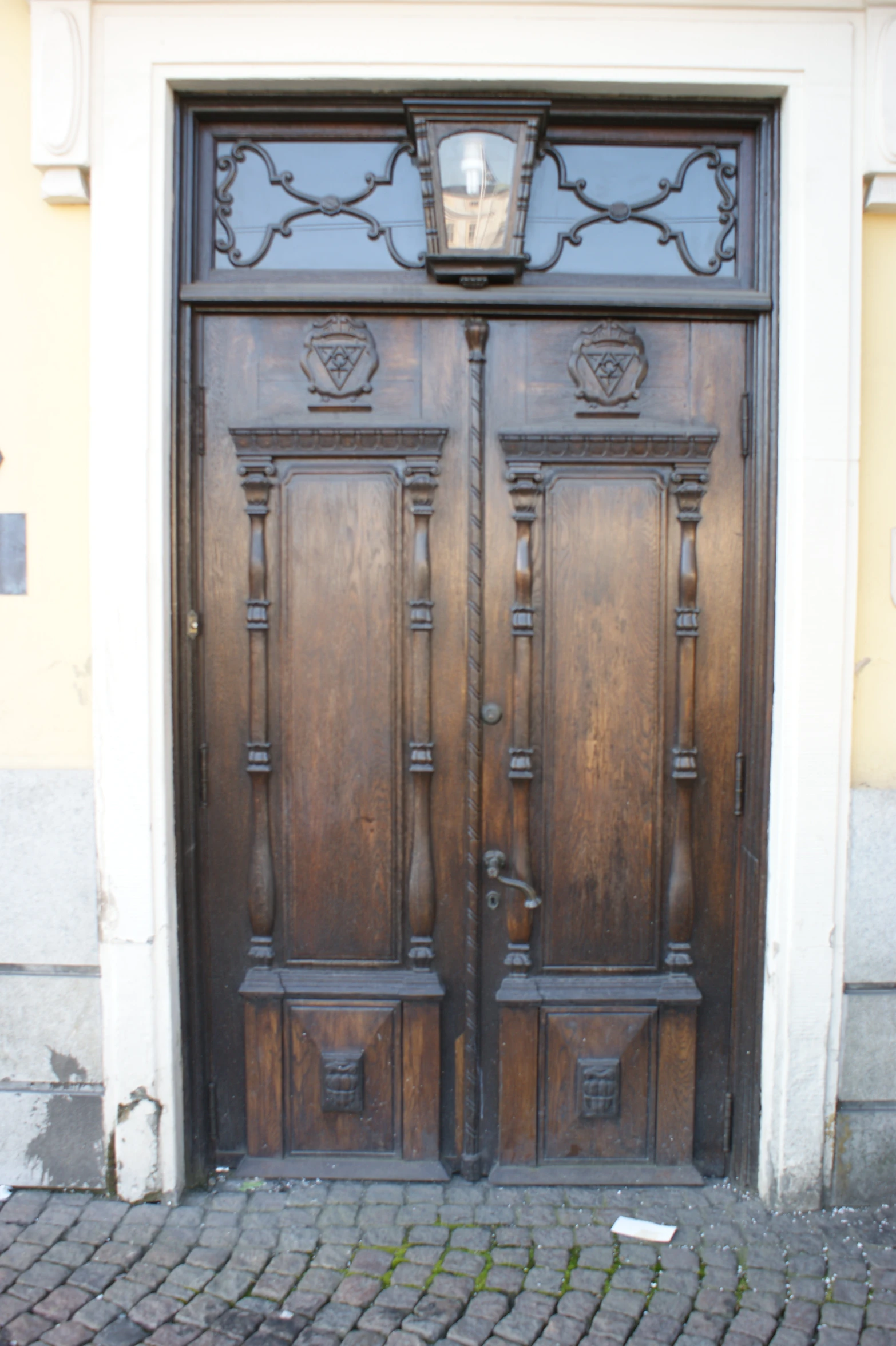 a wooden door is shown with light on top