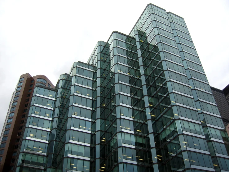 the top of the tall building shows a number of windows