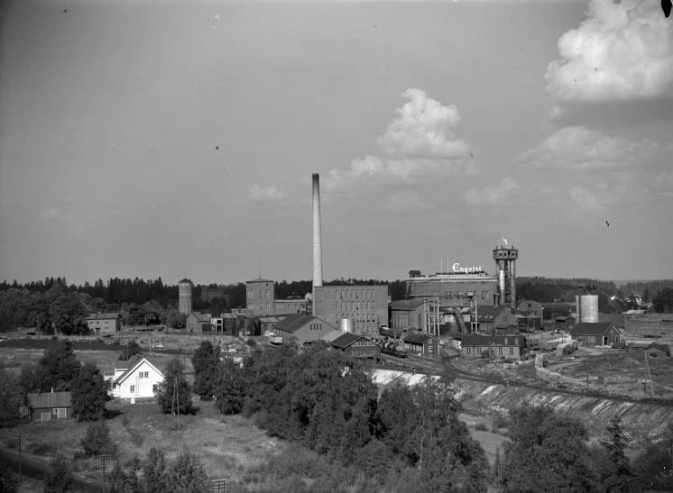 an industrial area with some buildings and trees