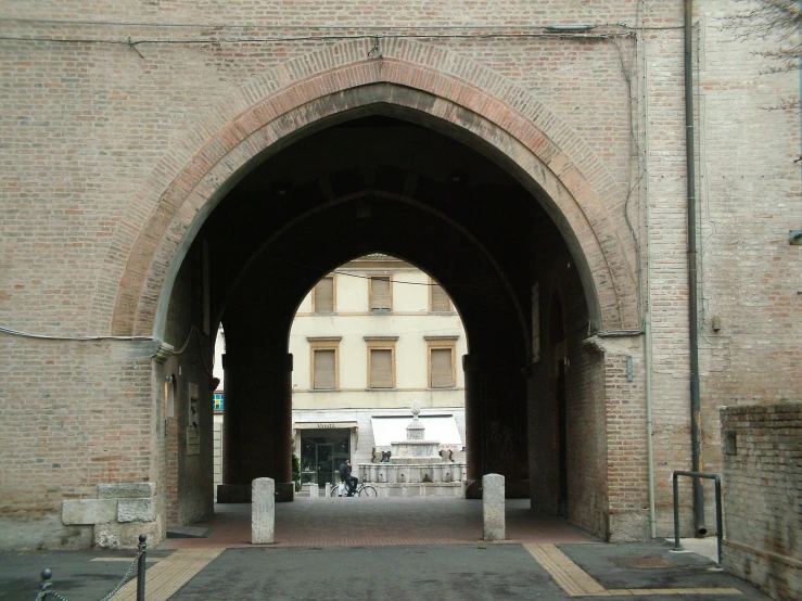 a city arch with some bicycles on the side