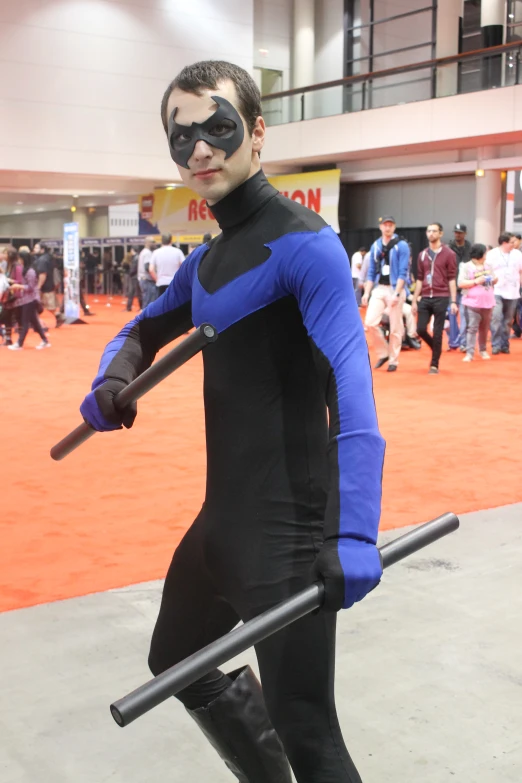 a young man with an unusual costume is on display