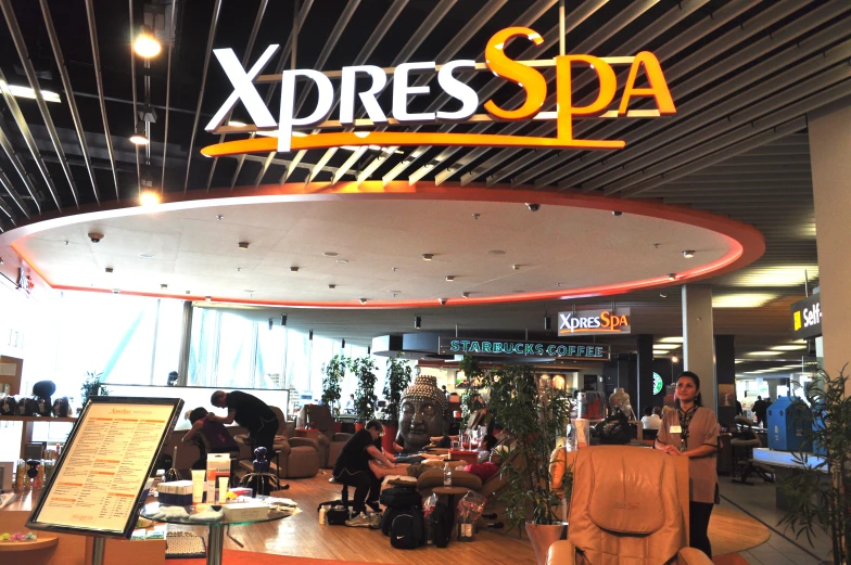 an image of a sign that says xpdres spa in the background