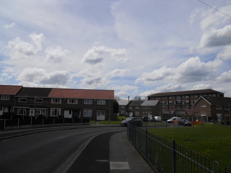 several houses and cars sitting in a residential neighborhood