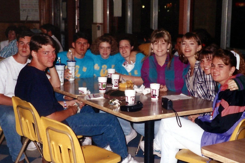 a group of people that are sitting around a table