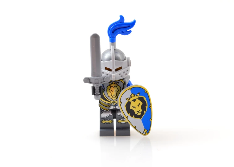 a lego knight standing in front of a white backdrop