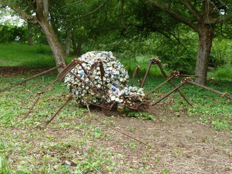 some kind of sculpture made with junk and a spider