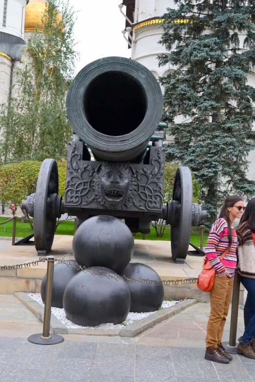 two young people kissing in front of a war machine