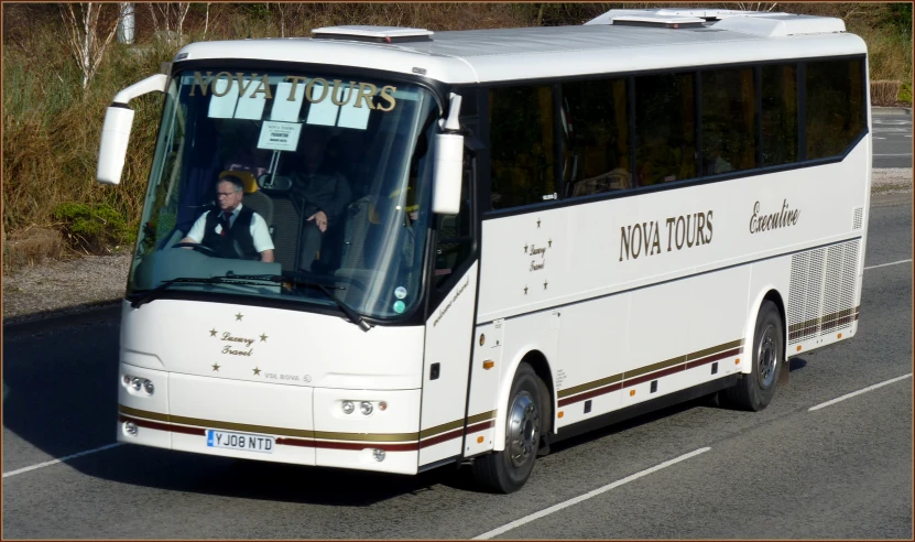 there is a tour bus that has people on it