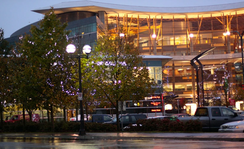 a large building sitting next to a street with cars