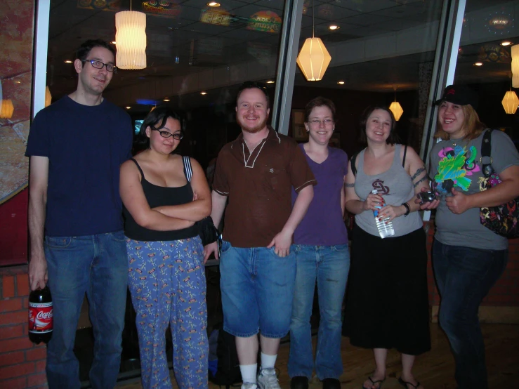 a group of people pose in a room