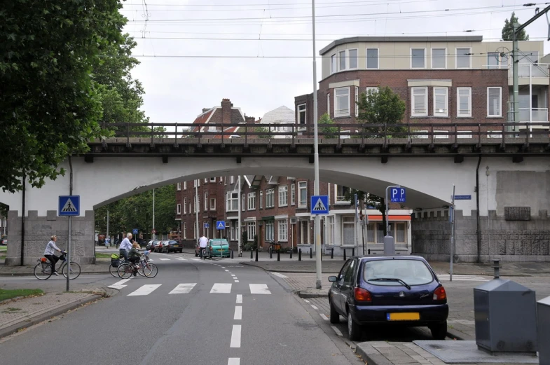 traffic beneath the bridge in this city intersection