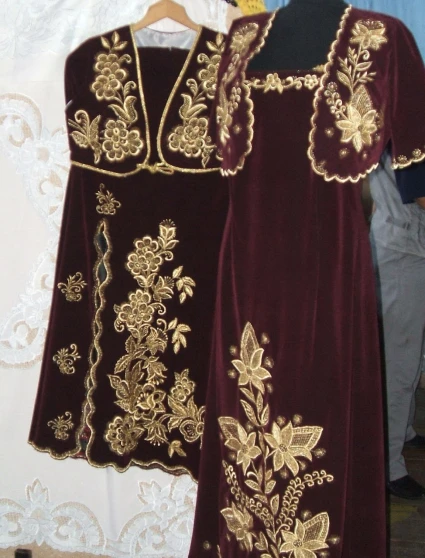 the clothes on display are decorated with gold