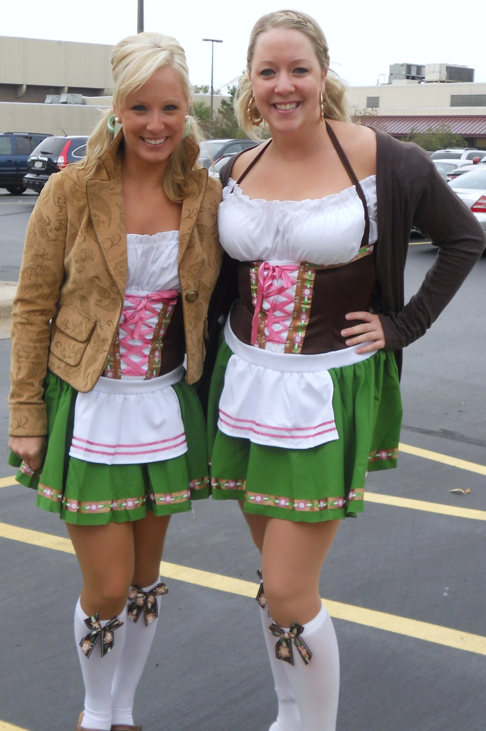 two girls dressed up for a show posing for a picture