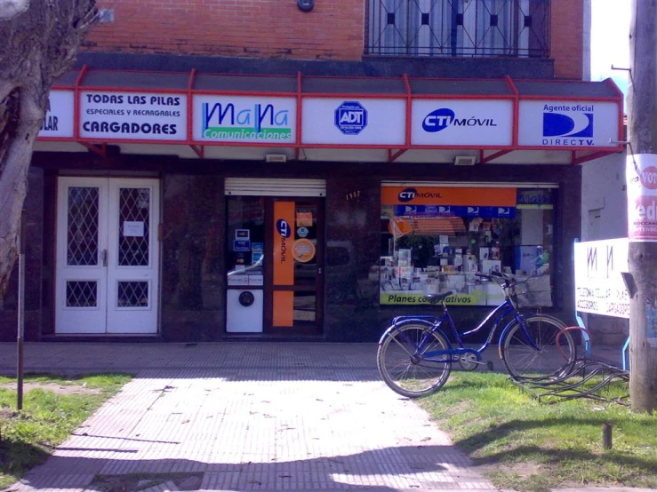 the bicycle is in front of the store