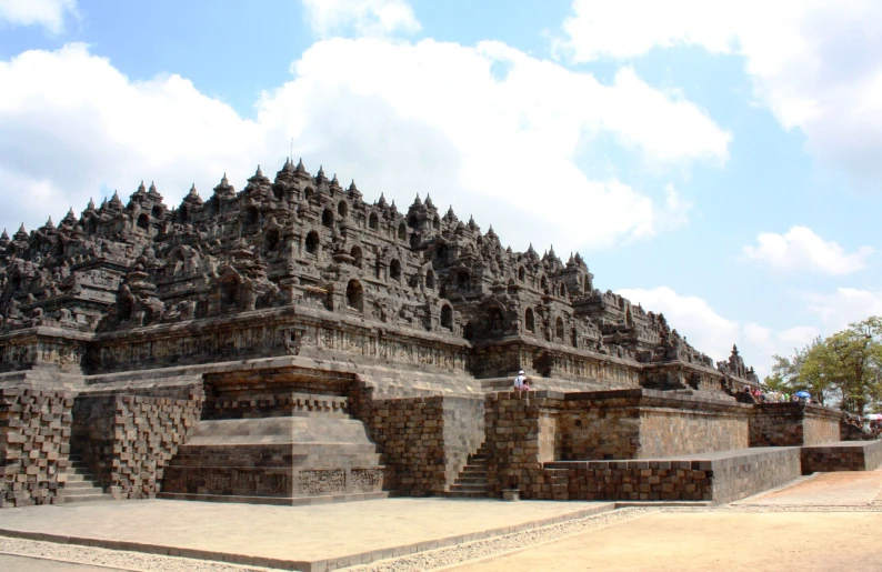 large stone structures are arranged in rows and made into an arch