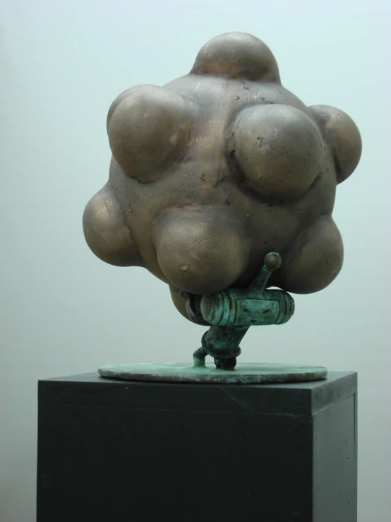 a statue is made with metal balls on the base