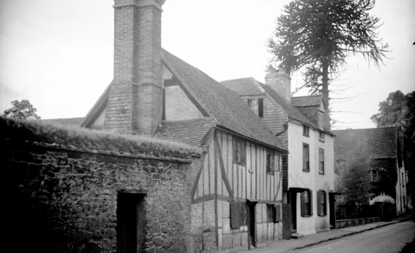 a black and white po shows buildings in a village