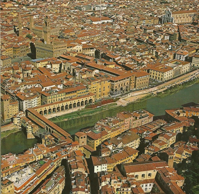 aerial view of city center with river and buildings