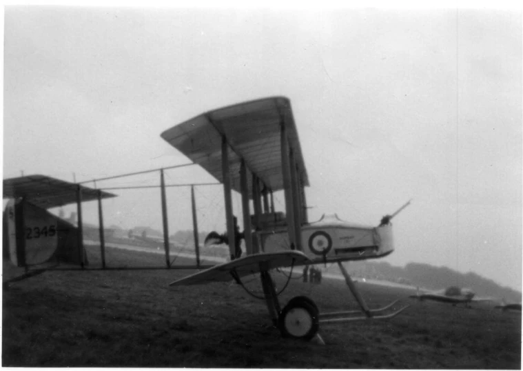 a plane sitting on top of a grass field