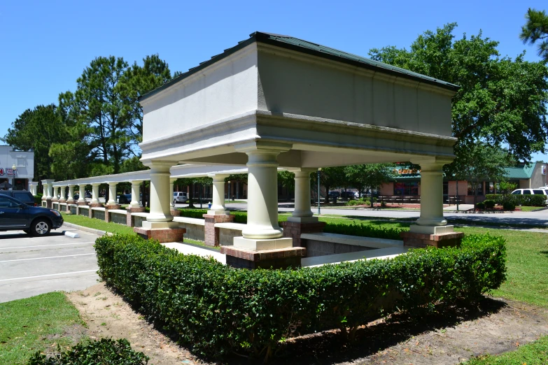 a park with benches and a covered area