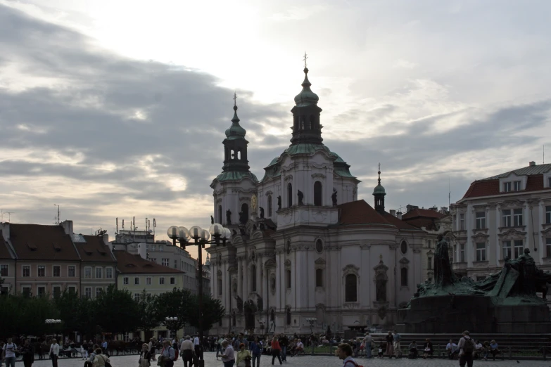 a building with towers sitting on top of it's roof