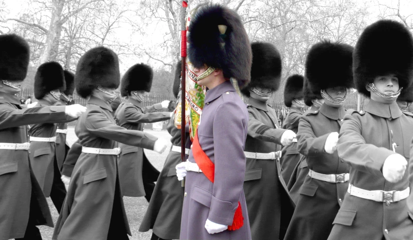 military soldiers wearing uniform and marching in the park