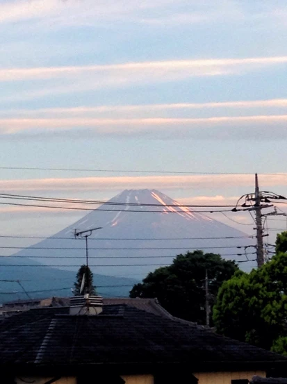 a large volcano with a few power lines