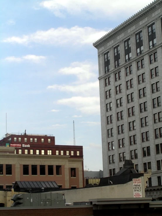 a couple of tall buildings sitting next to each other