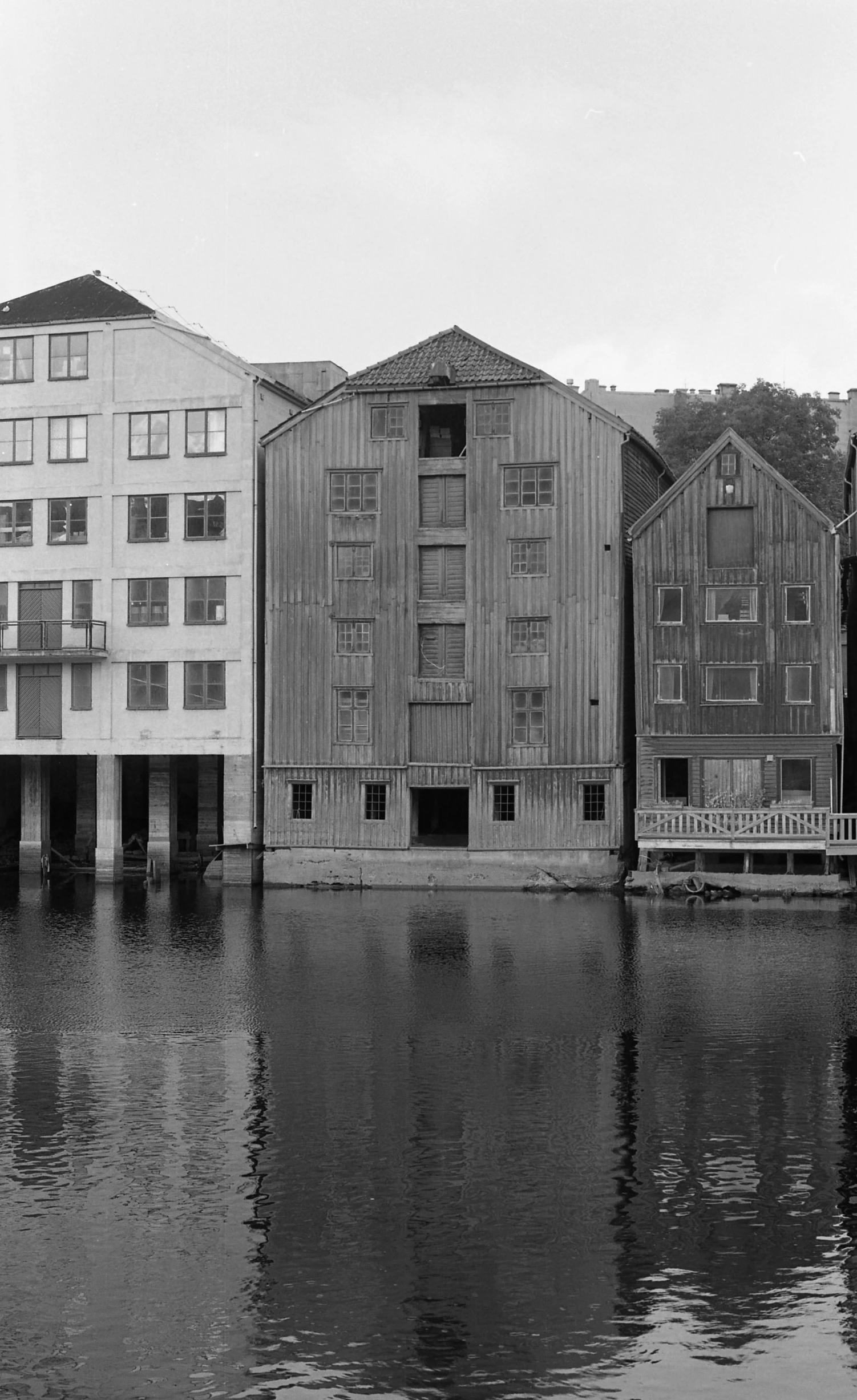 a black and white po of some buildings over water