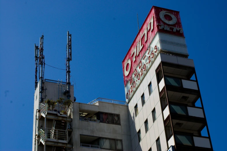 tall buildings with very large signs on top