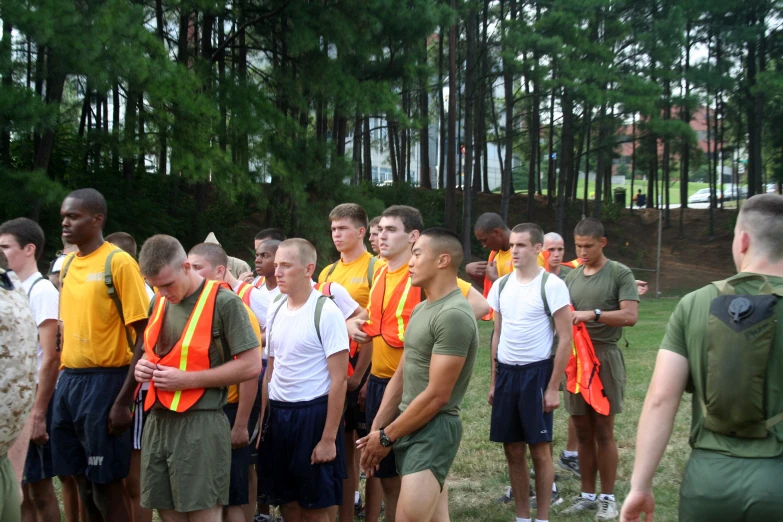 several military men in uniforms on a field