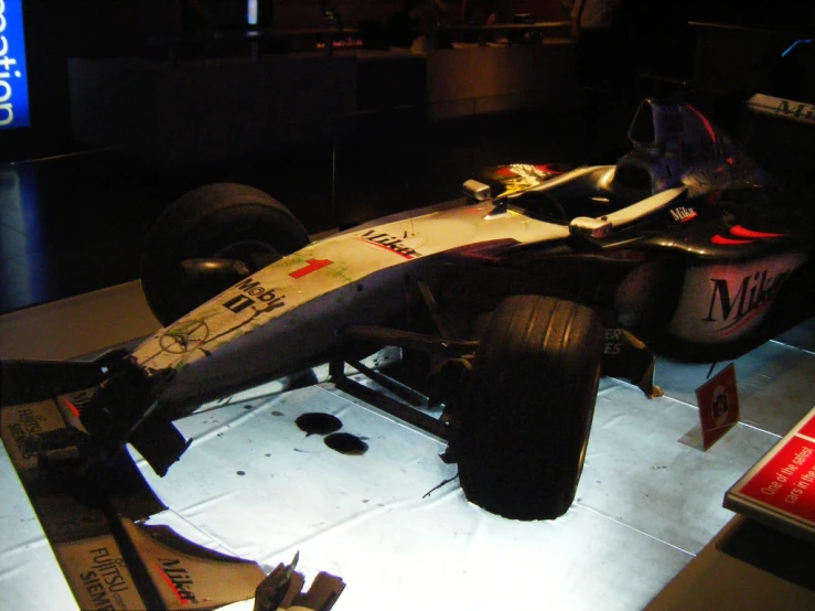 a racing car displayed in a museum display