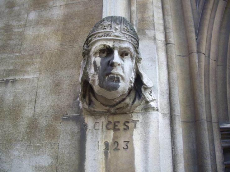 the statue on the corner of an old building