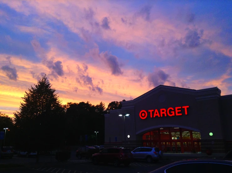 a store front with a large sky behind it