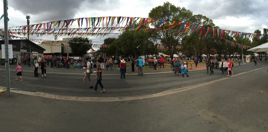 an aerial view of several people walking in a street