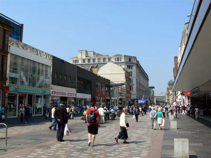 this is an urban area where many people are walking down the road