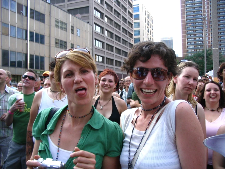 a large group of women standing around together