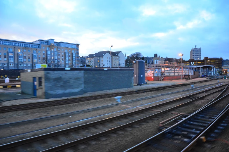 a long train track running next to a building