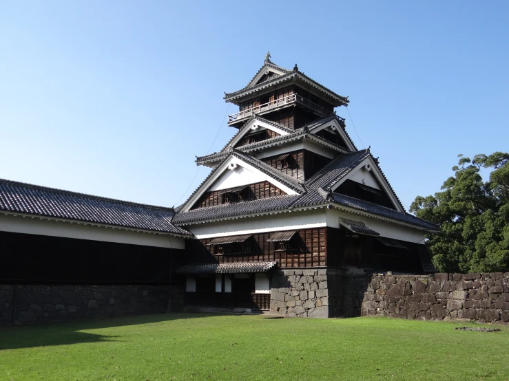 the tower of a building has black roofing