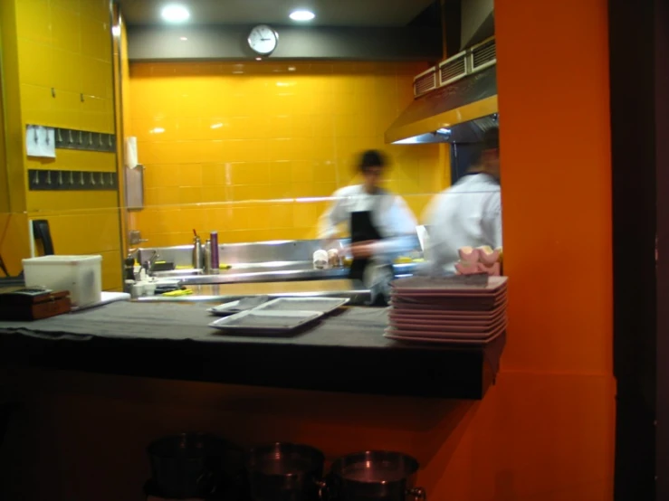 a man that is standing in front of a counter