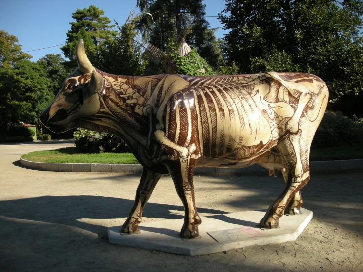 a statue of a steer with a skeleton design