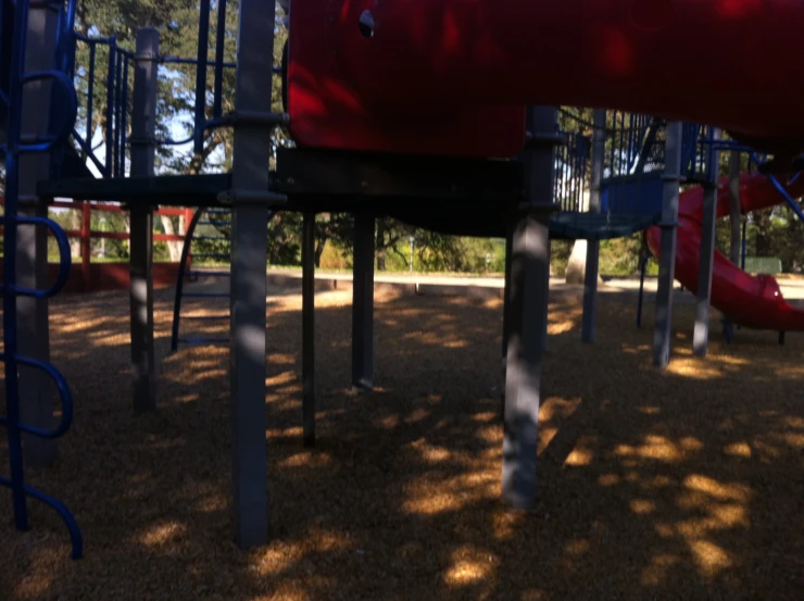 children's playground set with a red slide