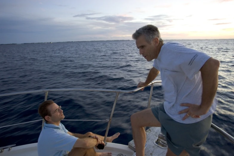 two men on a boat on the ocean