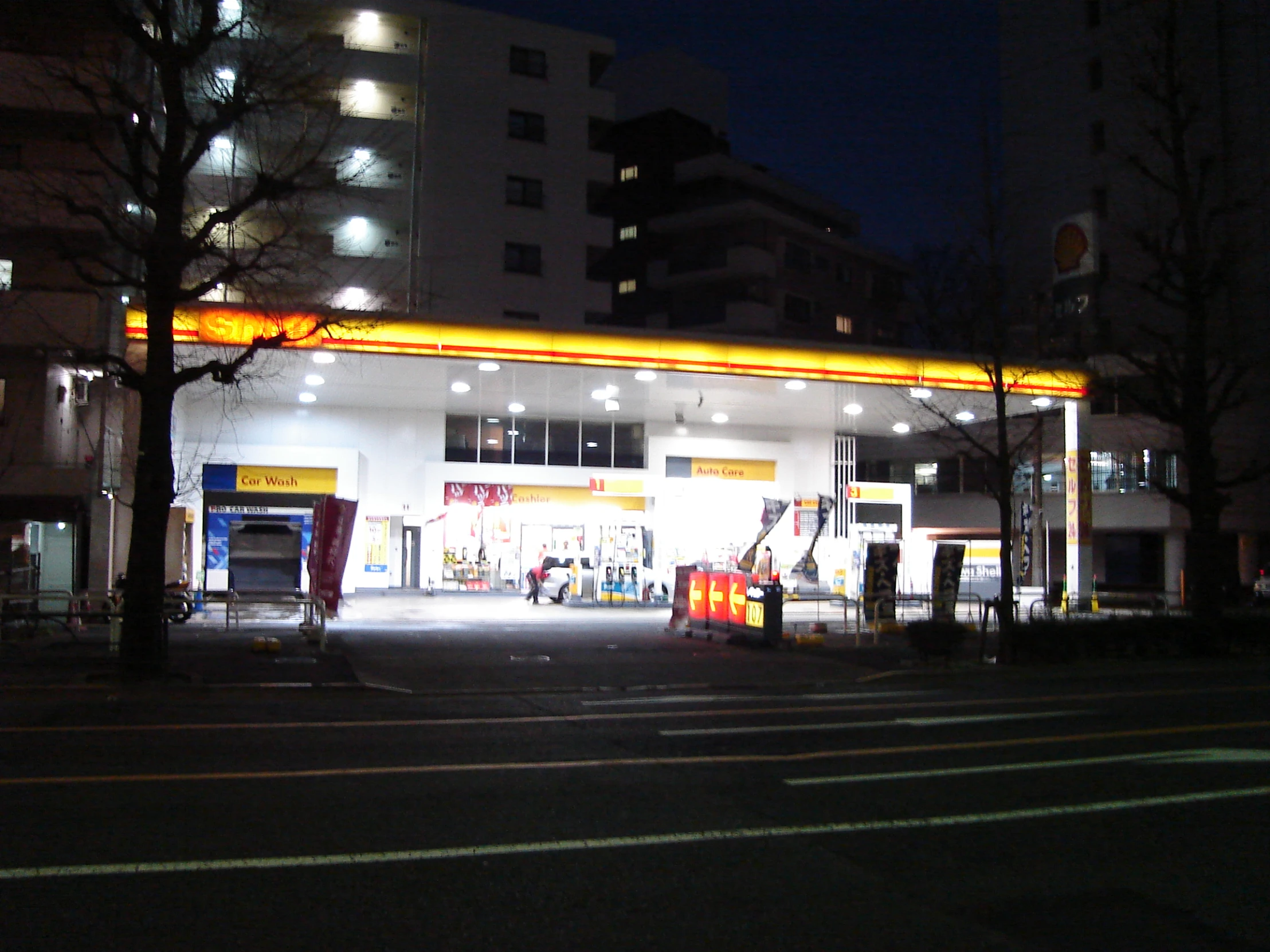 this is an image of a gas station at night