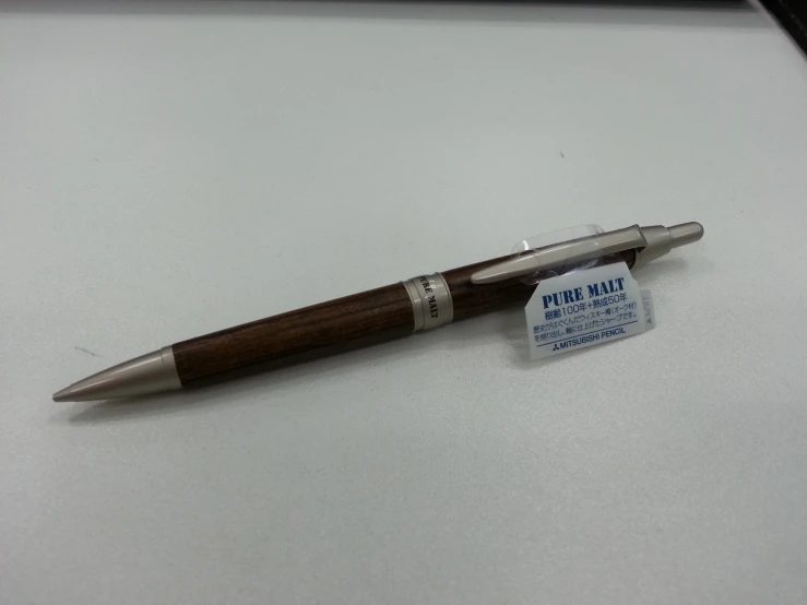 an object of metal pen sitting on a counter top