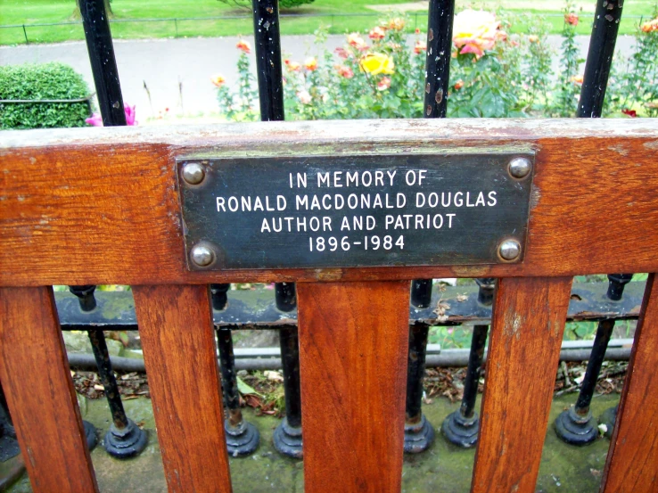 plaque on fence explaining memory of ronald mcdonald douglas